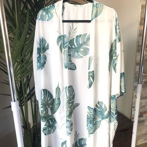 Tropical palm leaf duster can be used as cover up